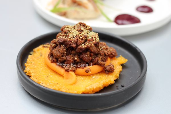 Owamni by The Sioux Chef signature dishes  Menu is seasonal and features items like Bison Tartare, Wojape (berry sauce), Smoked Whitefish, dishes with wild rice, corn, beans, and foraged ingredients. No wheat flour, dairy, or cane sugar.